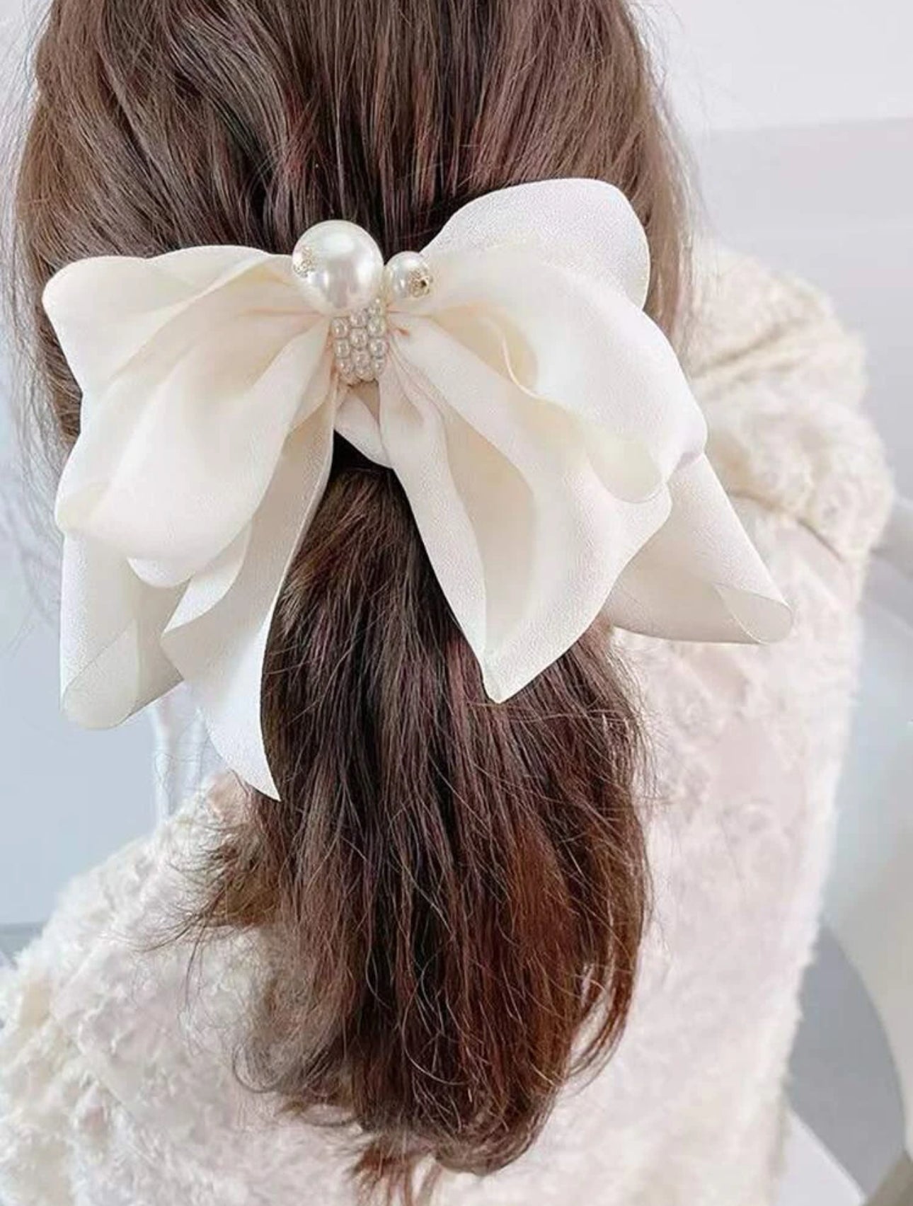 White bow with pearl