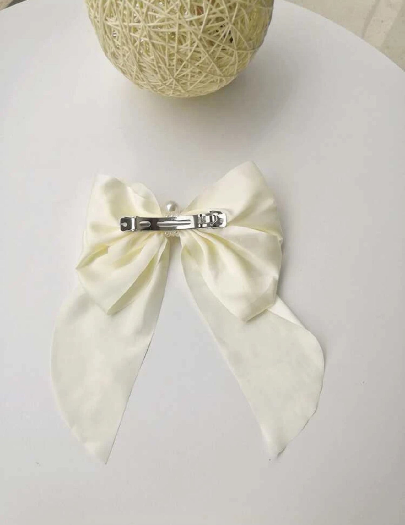 White bow with pearl