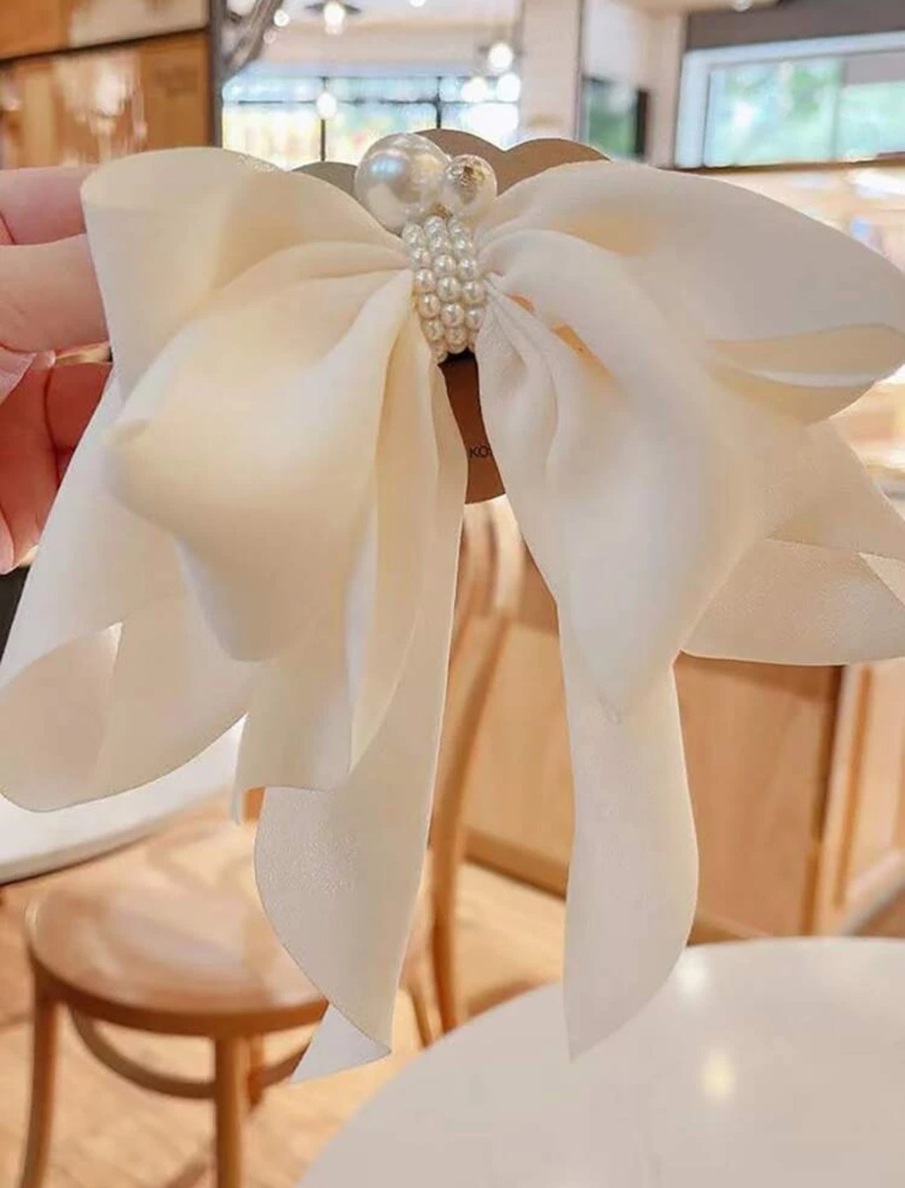 White bow with pearl